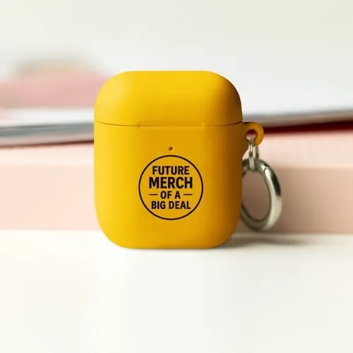 A yellow Airpods case with black text that says Future Merch of a Big Deal representing tech accessory promotional products available in our store for same-day online ordering in New York City .
